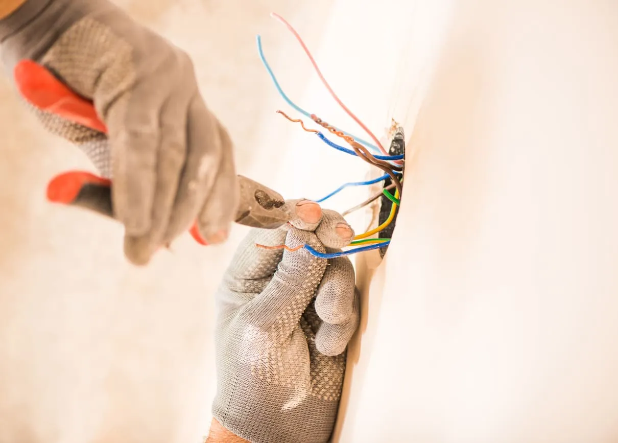 Electrician Holding Wires