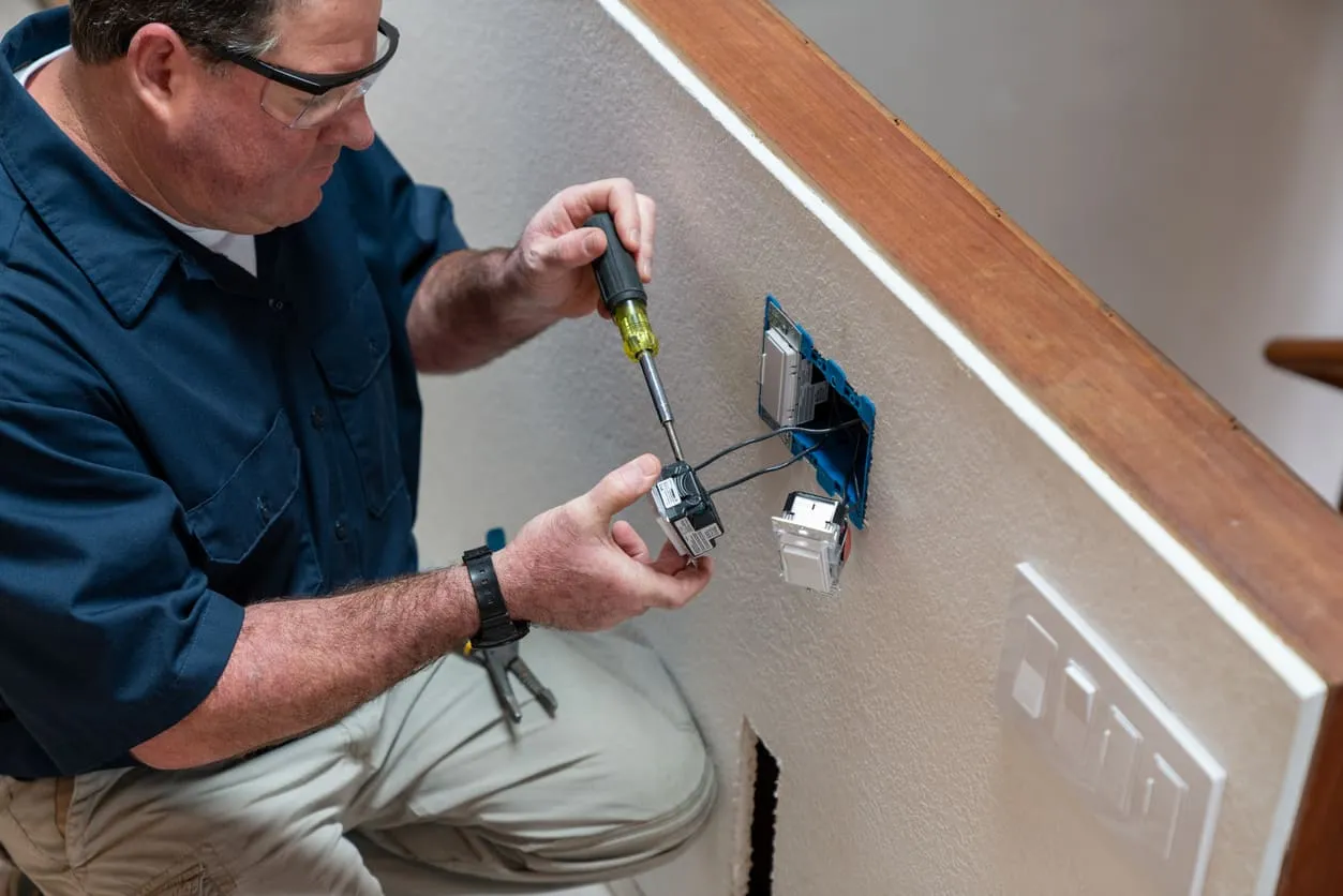 Electrician Installing a Switch