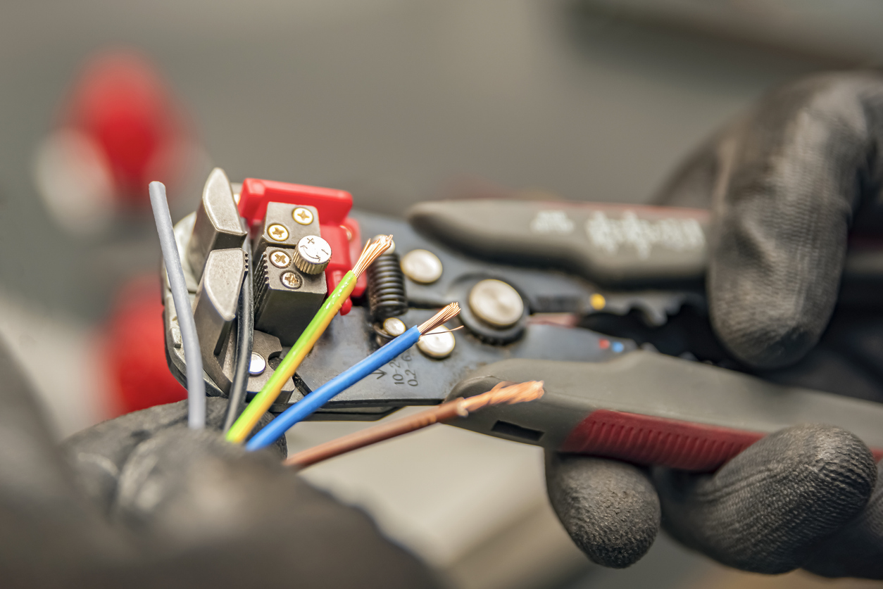 Electrician Using Tool