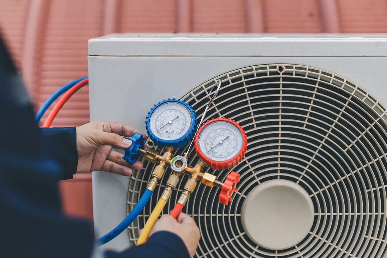 Technician Checking AC Unit