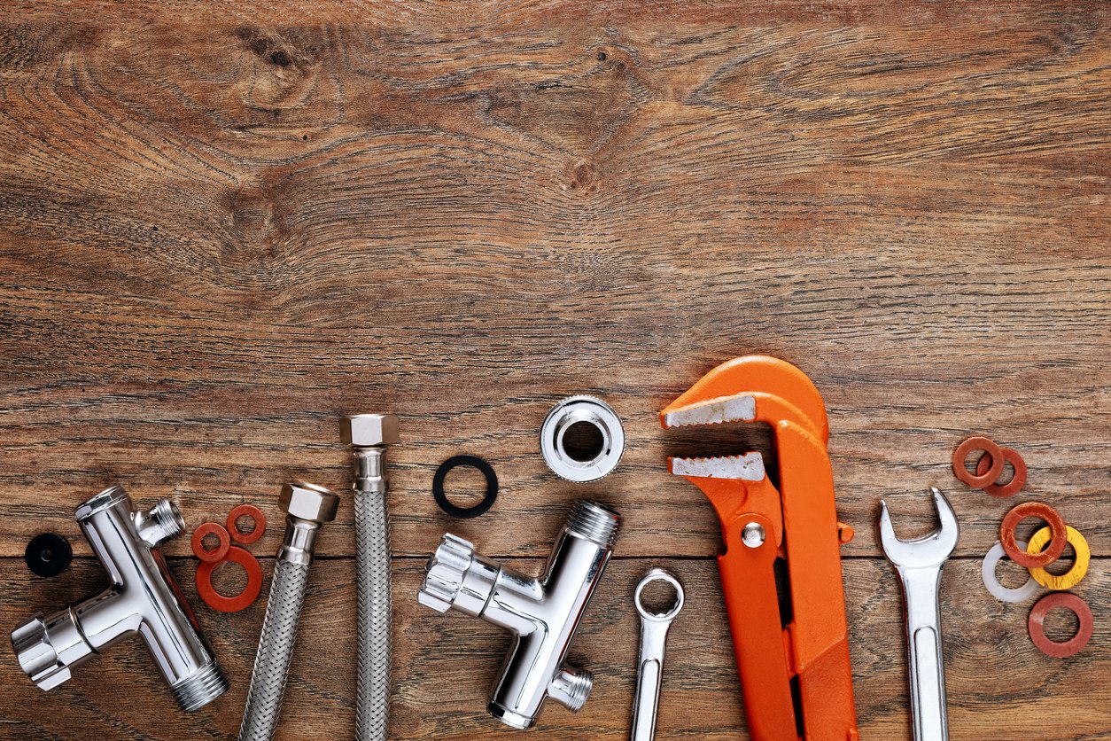 Plumbing Tools on Wooden Table